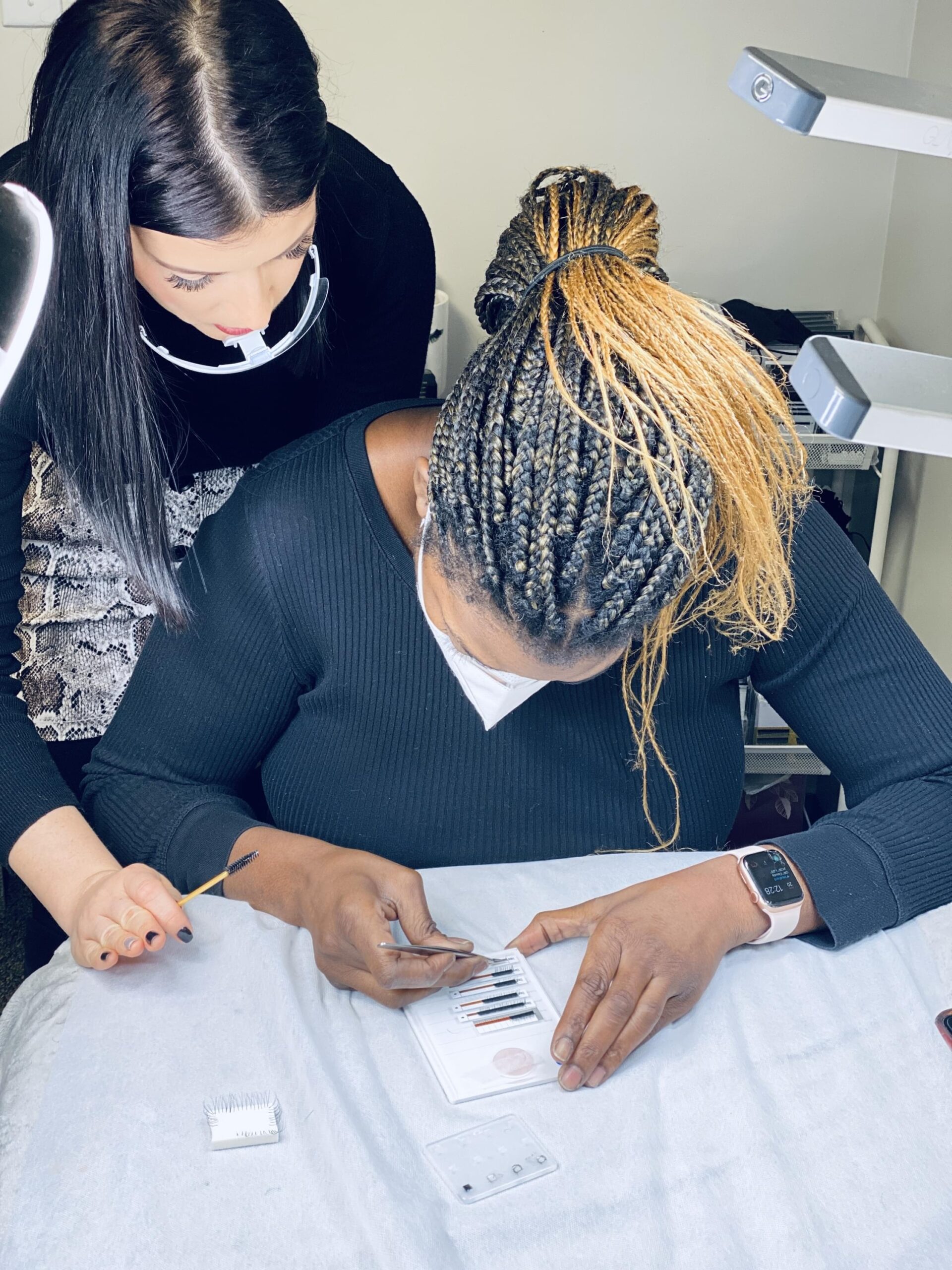 Student choosing lash products in class